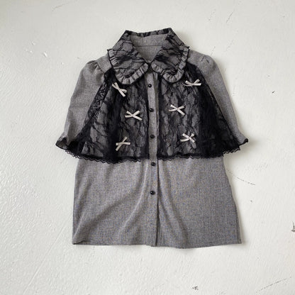 Gray outfit with lace detailing on a white background