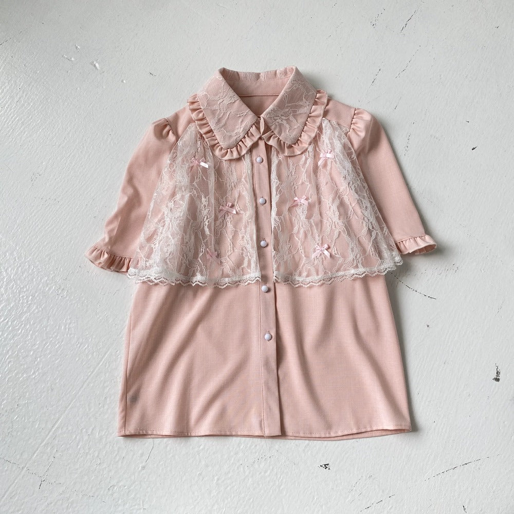 Pink dress with lace details on a white background