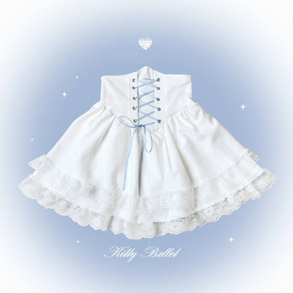 White Lolita-style skirt with lace trim and blue ribbon laces, shown on a soft blue gradient background with decorative sparkles and the text 'Kitty Ballet' at the bottom.