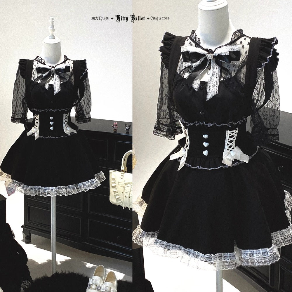 Black and white dress with bow details on a mannequin against a neutral background