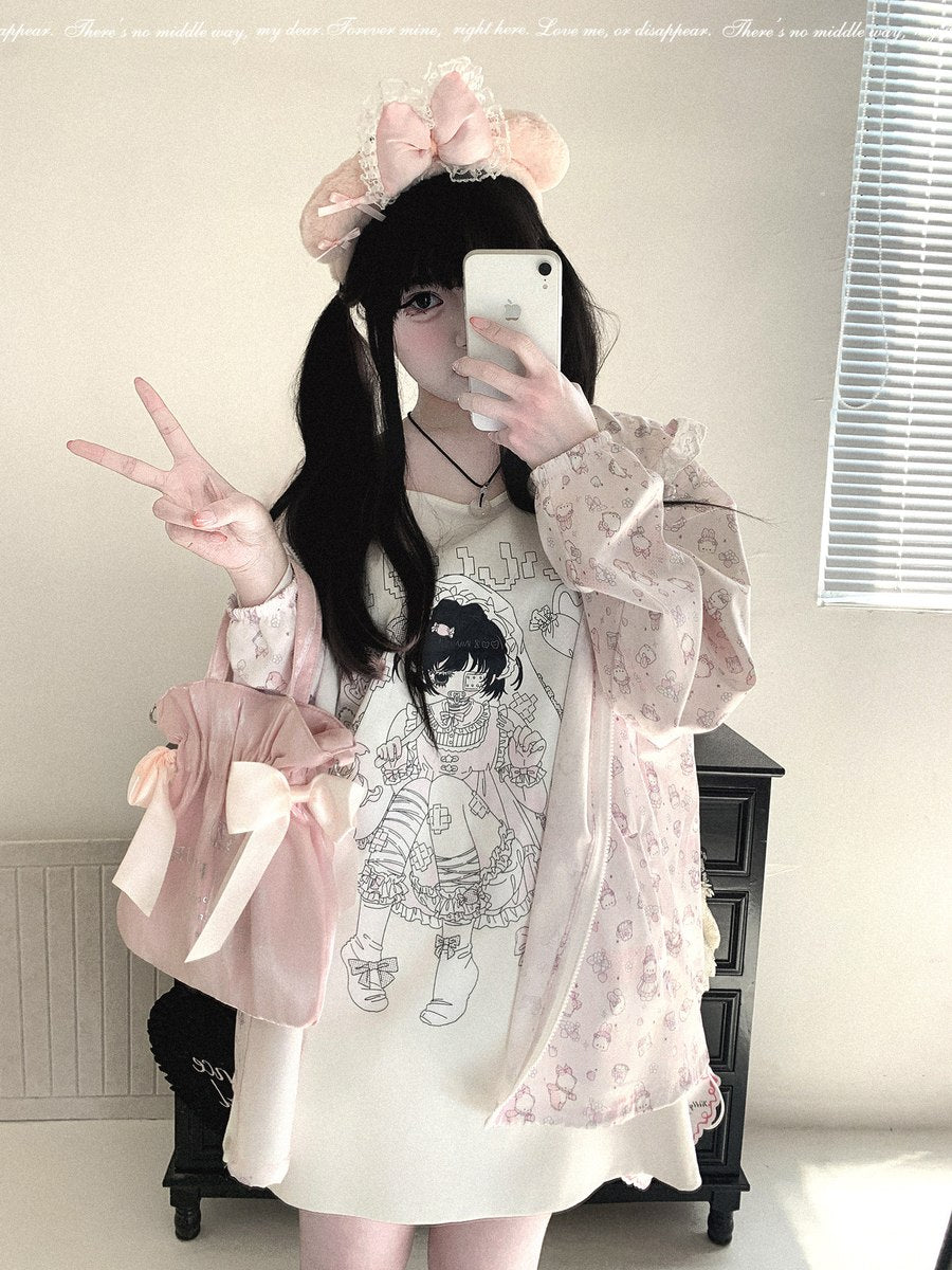 A person taking a mirror selfie wearing a pastel pink and white Lolita-style outfit, featuring a long-sleeve floral cardigan, a white dress with a black line-art graphic, a pink bow headband, and a matching pink bow bag.