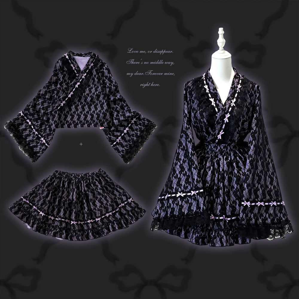 Black purple kimono dress with white accents on a mannequin against a dark background.