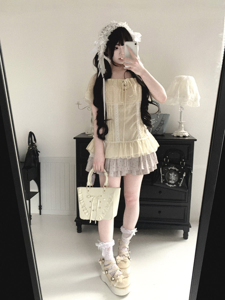 Person wearing a vintage-style outfit with a lace dress and matching bag in a room.