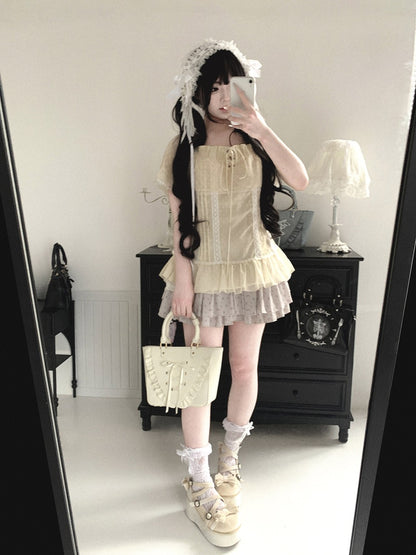 Person wearing a vintage-style outfit with a lace dress and matching bag in a room.