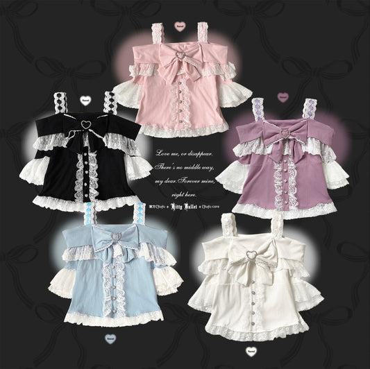 Collection of Lolita fashion outfits on hangers with a dark background.