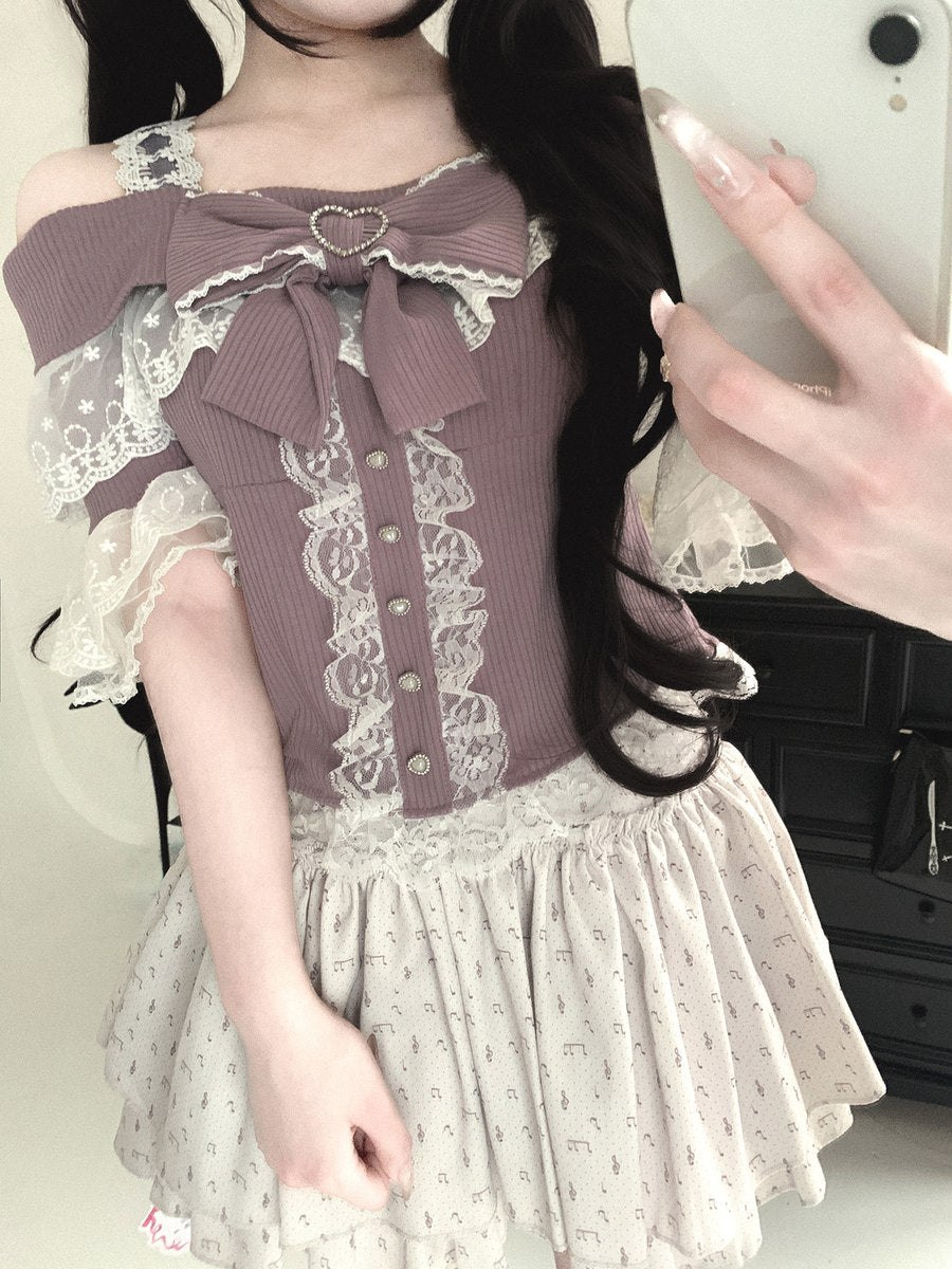 Person wearing a detailed outfit with a large bow and lace details, standing in front of a mirror.