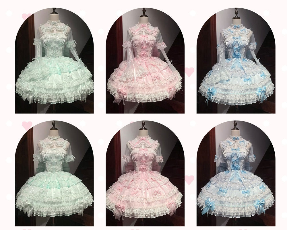 Six mannequins wearing dresses in pastel colors on a dark background