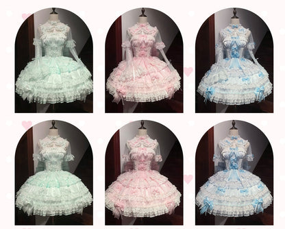 Six mannequins wearing dresses in pastel colors on a dark background