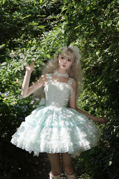 Person wearing a light blue dress with ruffles standing in a forest setting