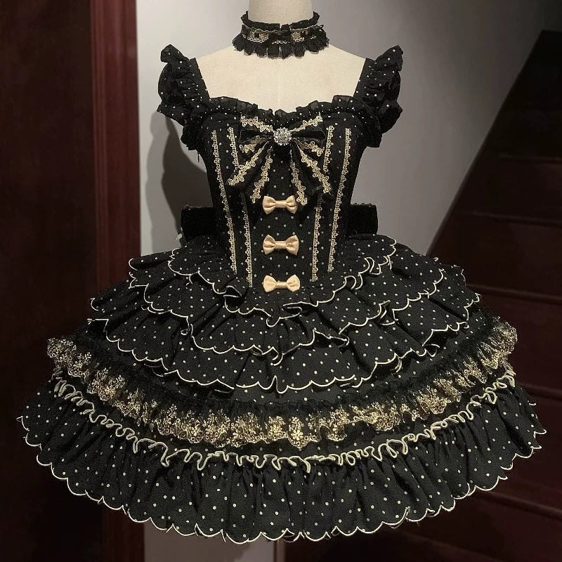 Black and gold dress on a mannequin against a neutral background