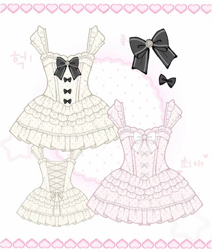 Two lace outfits with black bows on a pink heart patterned background