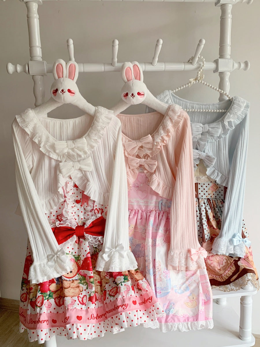 Two dresses on mannequins with bunny ears against a neutral background