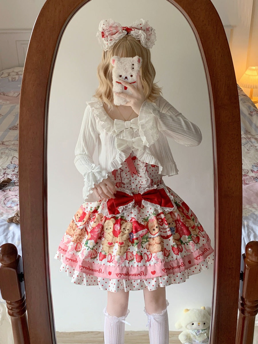 Person wearing a white blouse with ruffles and a colorful skirt in front of a mirror.