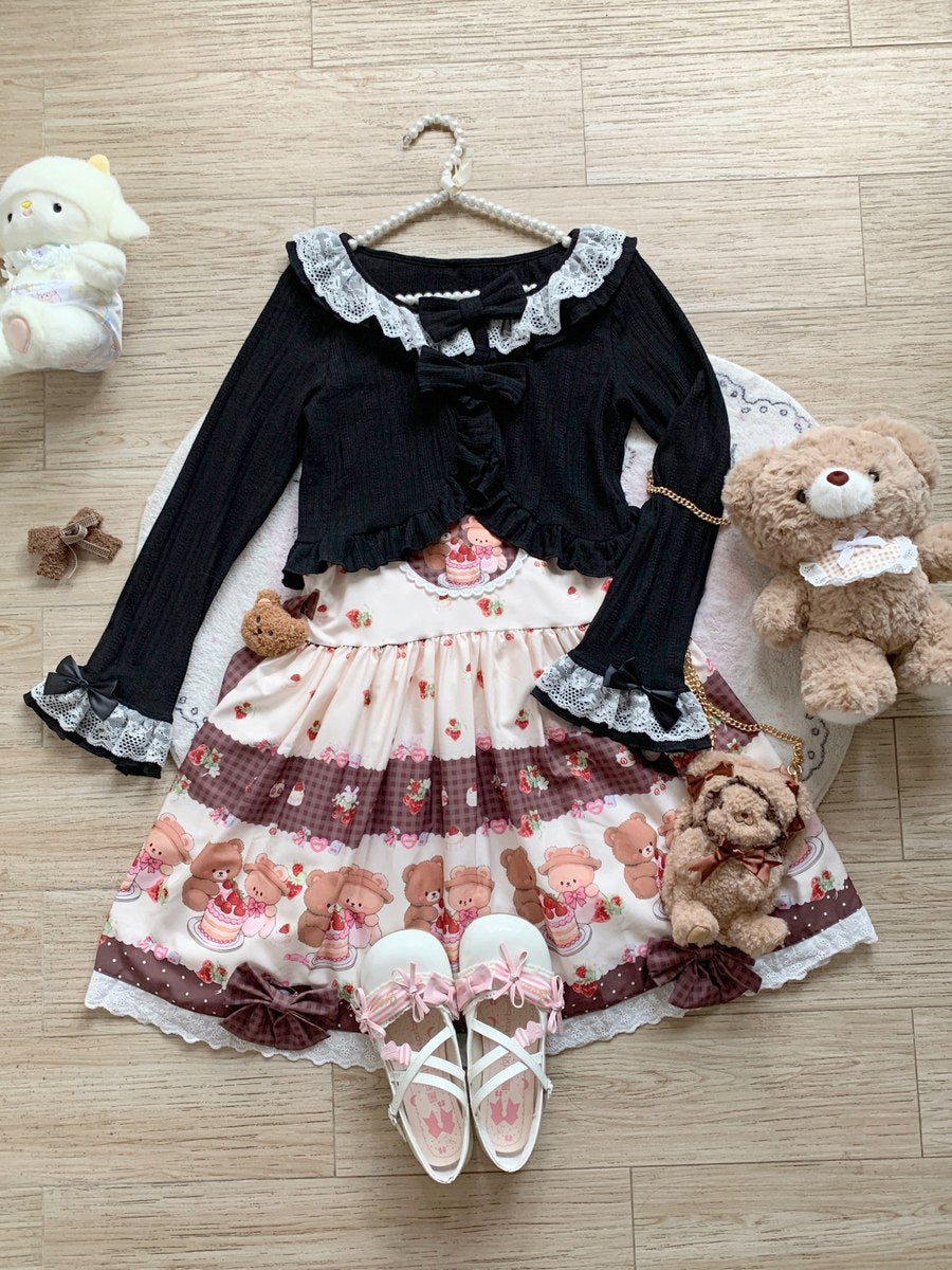 Cute outfit with black cardigan, floral dress, and white shoes on a wooden floor with teddy bears.