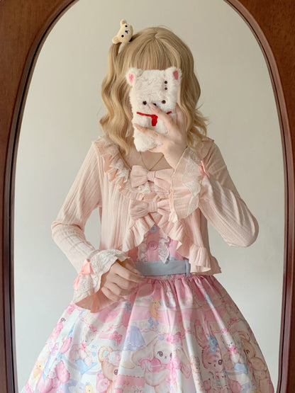 Person wearing a pink outfit with a floral skirt, holding a plush toy in front of their face.