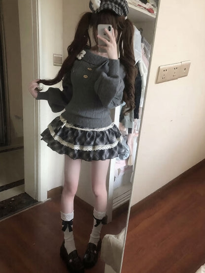 Person wearing a dark sweater and skirt with white lace trim, standing in front of a mirror.