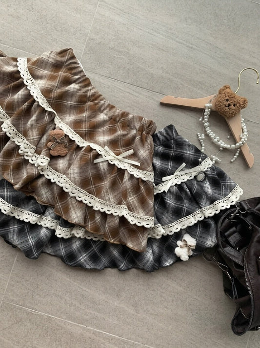 Plaid skirt with lace trim on a gray floor