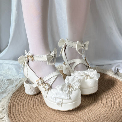 White lace-up shoes with decorative elements on a neutral background
