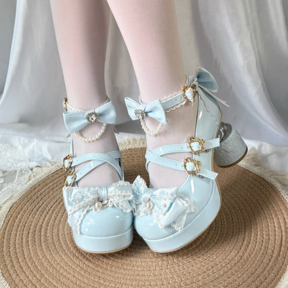 Light blue shoes with decorative bows and straps on a neutral background