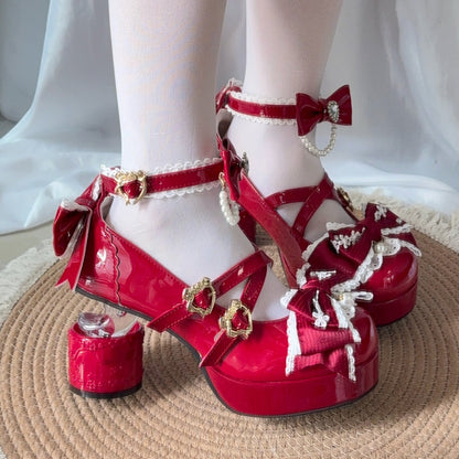 Red platform heels with decorative bows and pearls on a white background