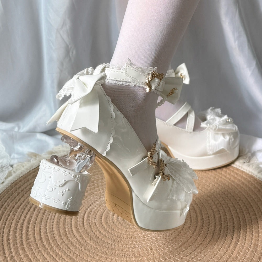 White lace-up high-heeled shoes with decorative elements on a neutral background