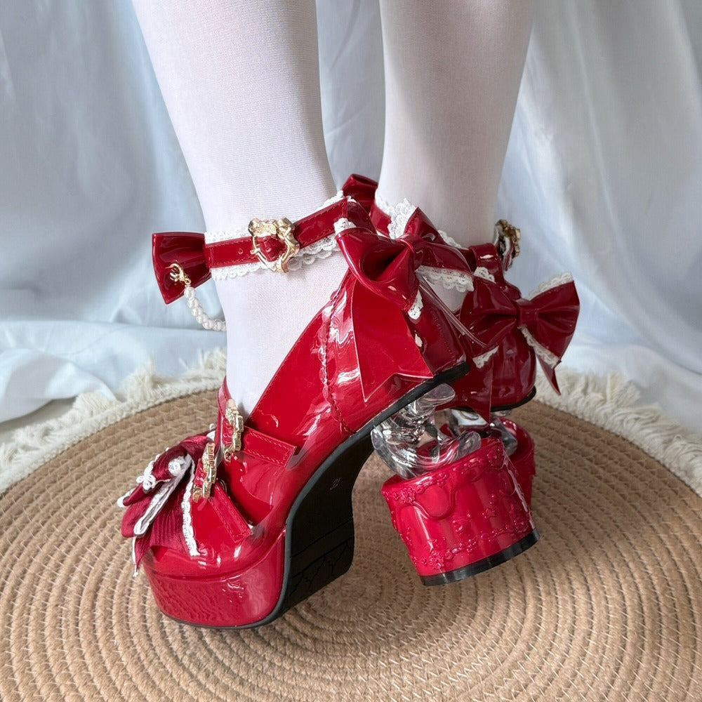 Red platform shoes with bows on a white background