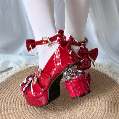 Red platform shoes with bows on a white background