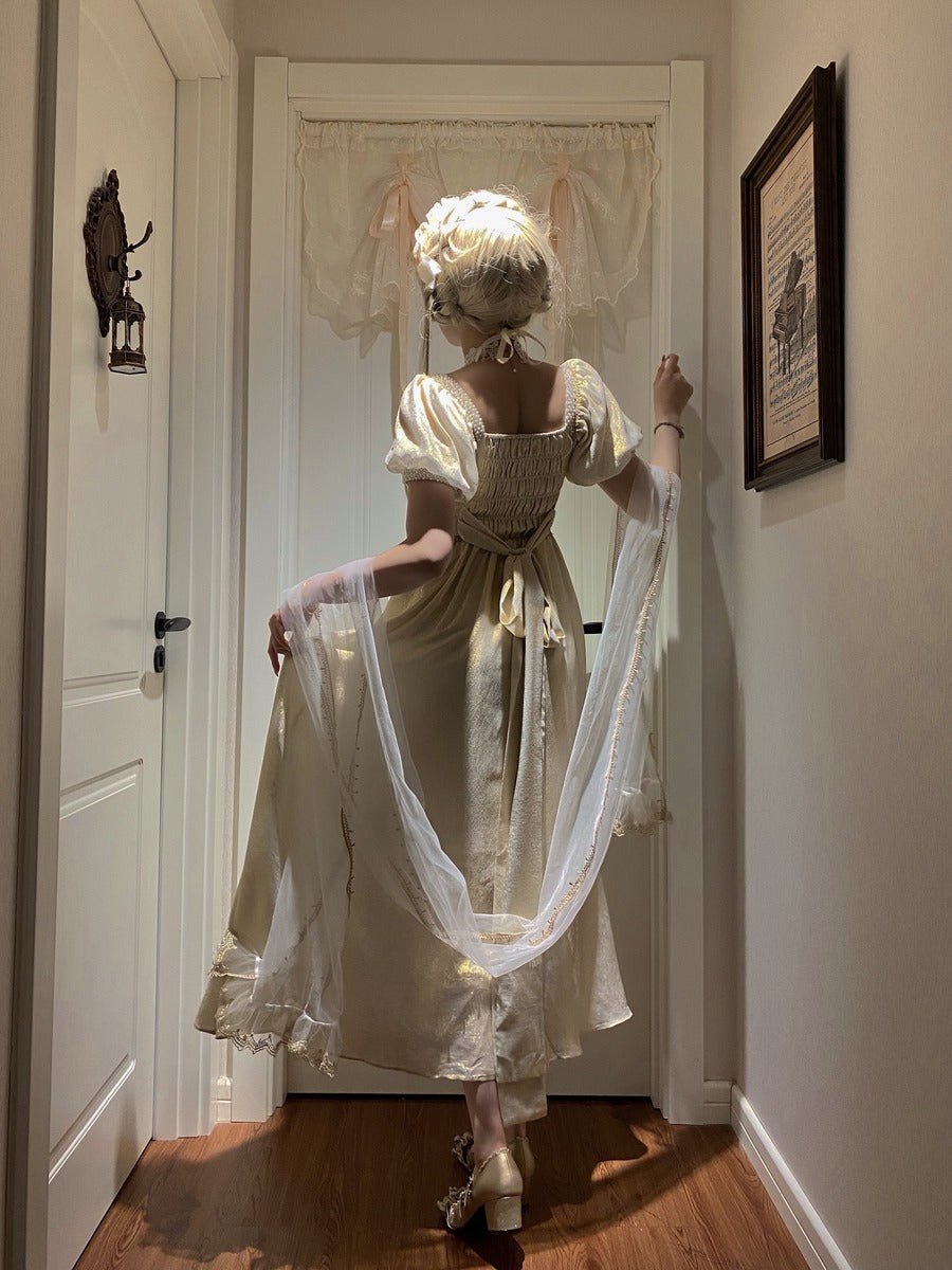 Woman in a historical dress standing in a hallway