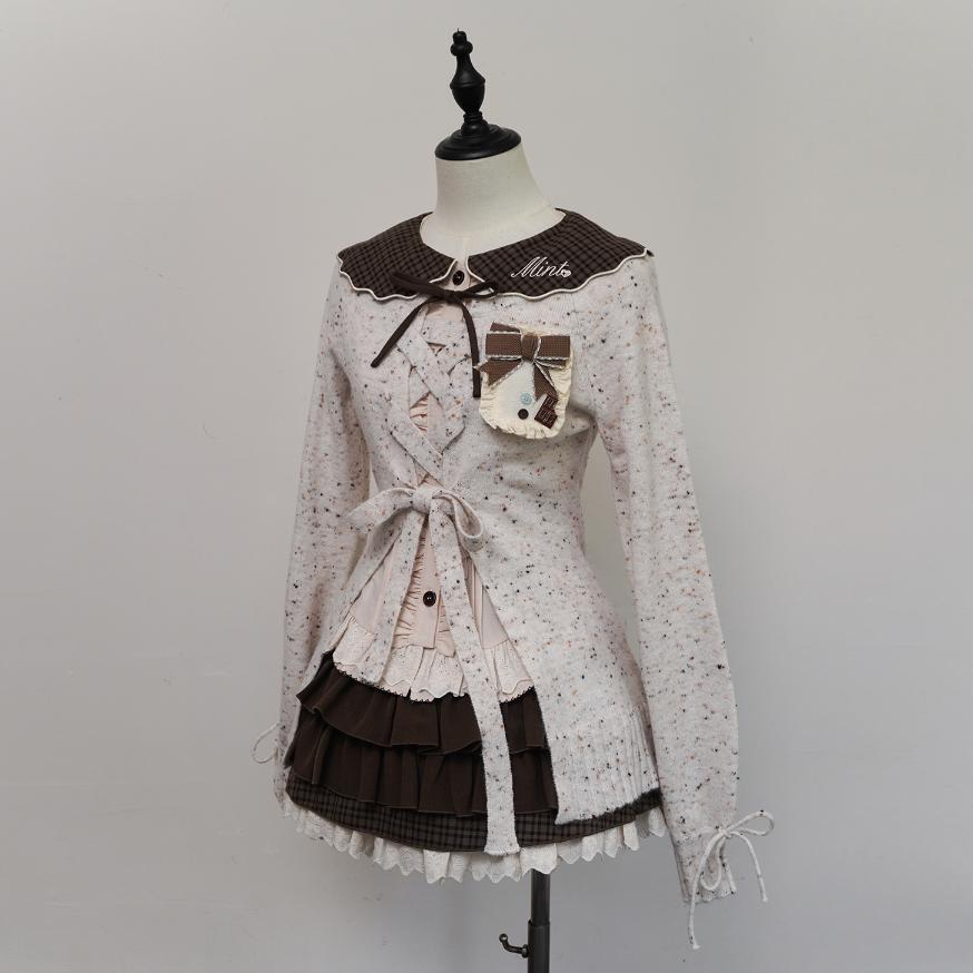 Lolita-style dress on a mannequin against a plain background