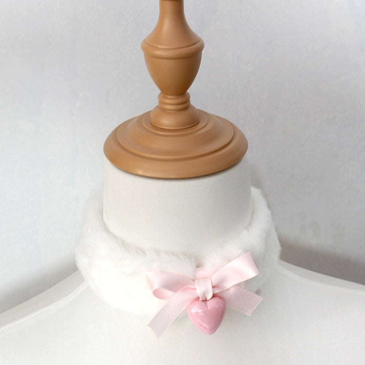 Mannequin with a pink bow and heart-shaped object on a white background