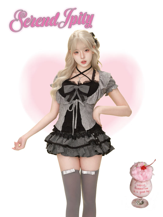 Person wearing a black and gray outfit.