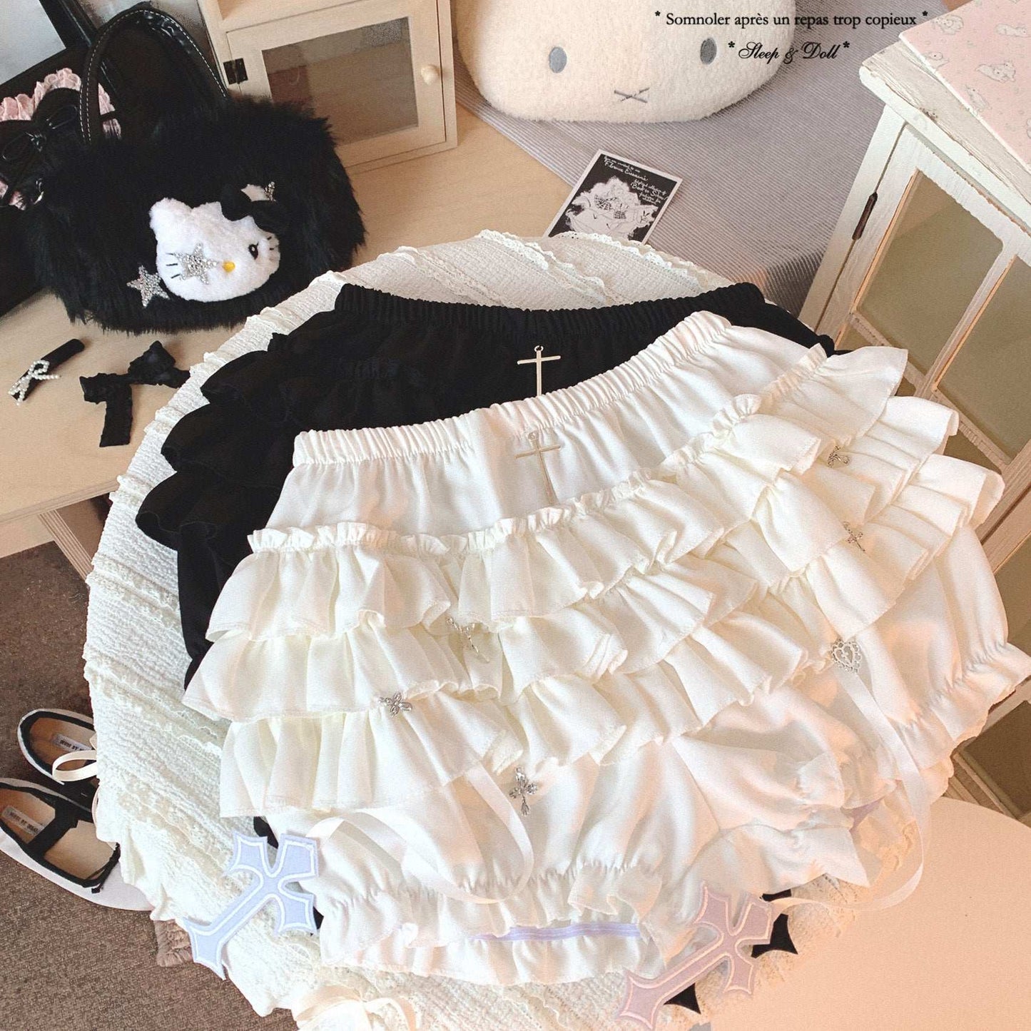 White lace petticoat with black top on a table with decorative items.
