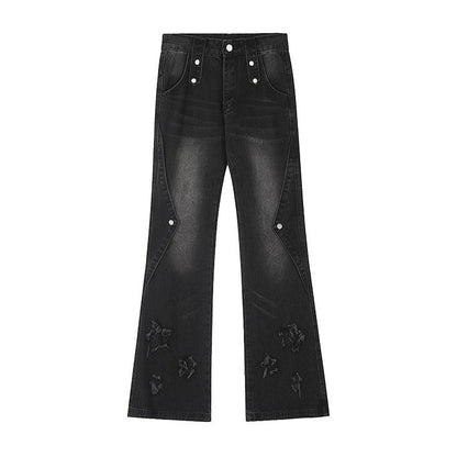 Black jeans with decorative elements on a white background