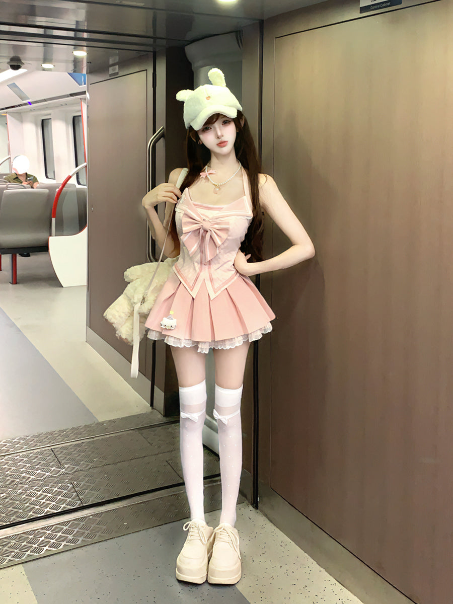 Person in a pink outfit with a large bow standing in an elevator.