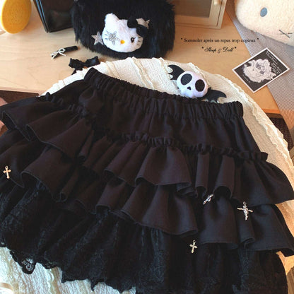 Black ruffled skirt with decorative elements on a textured surface