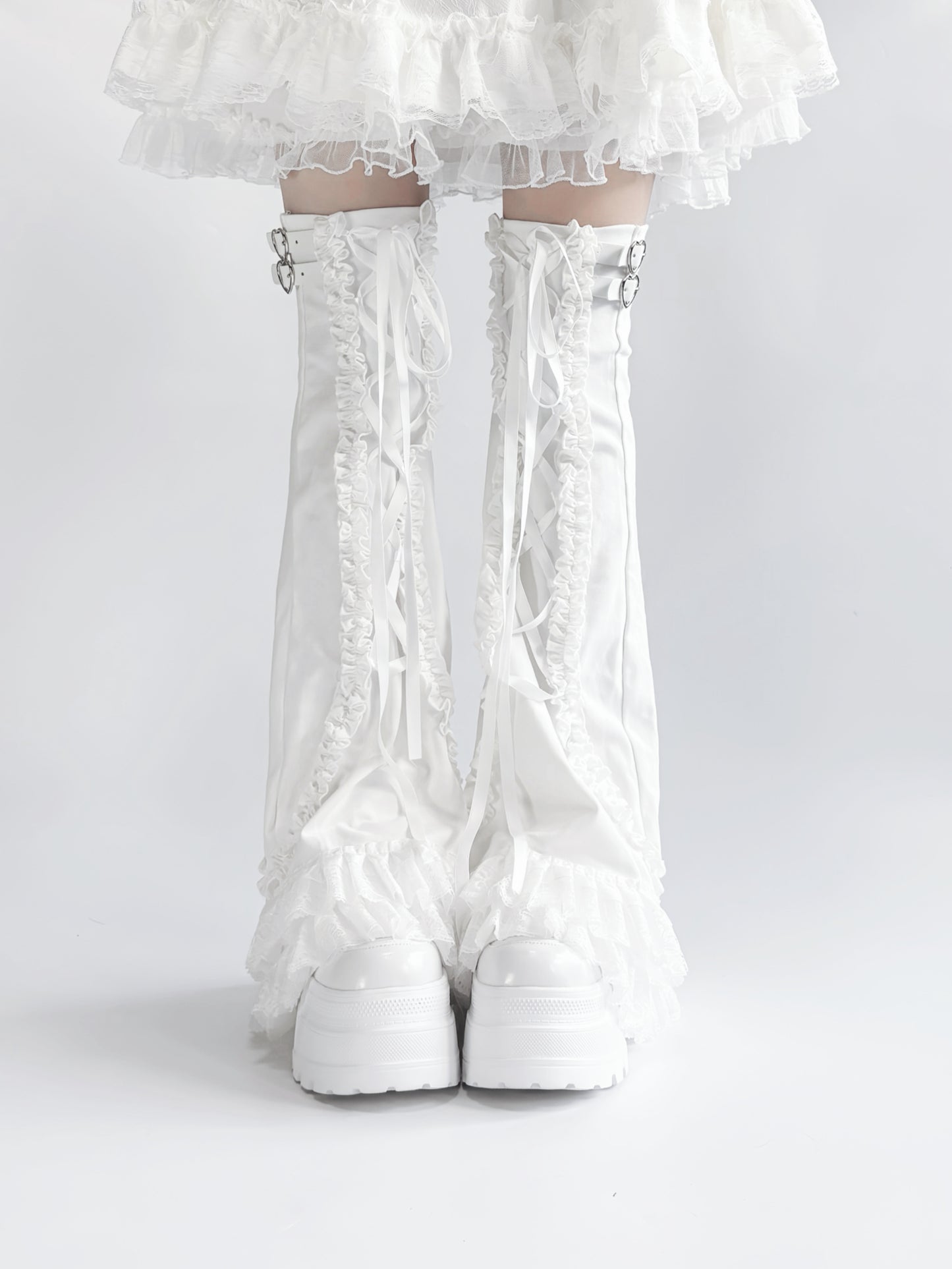 White lace-up leg warmers with a white background