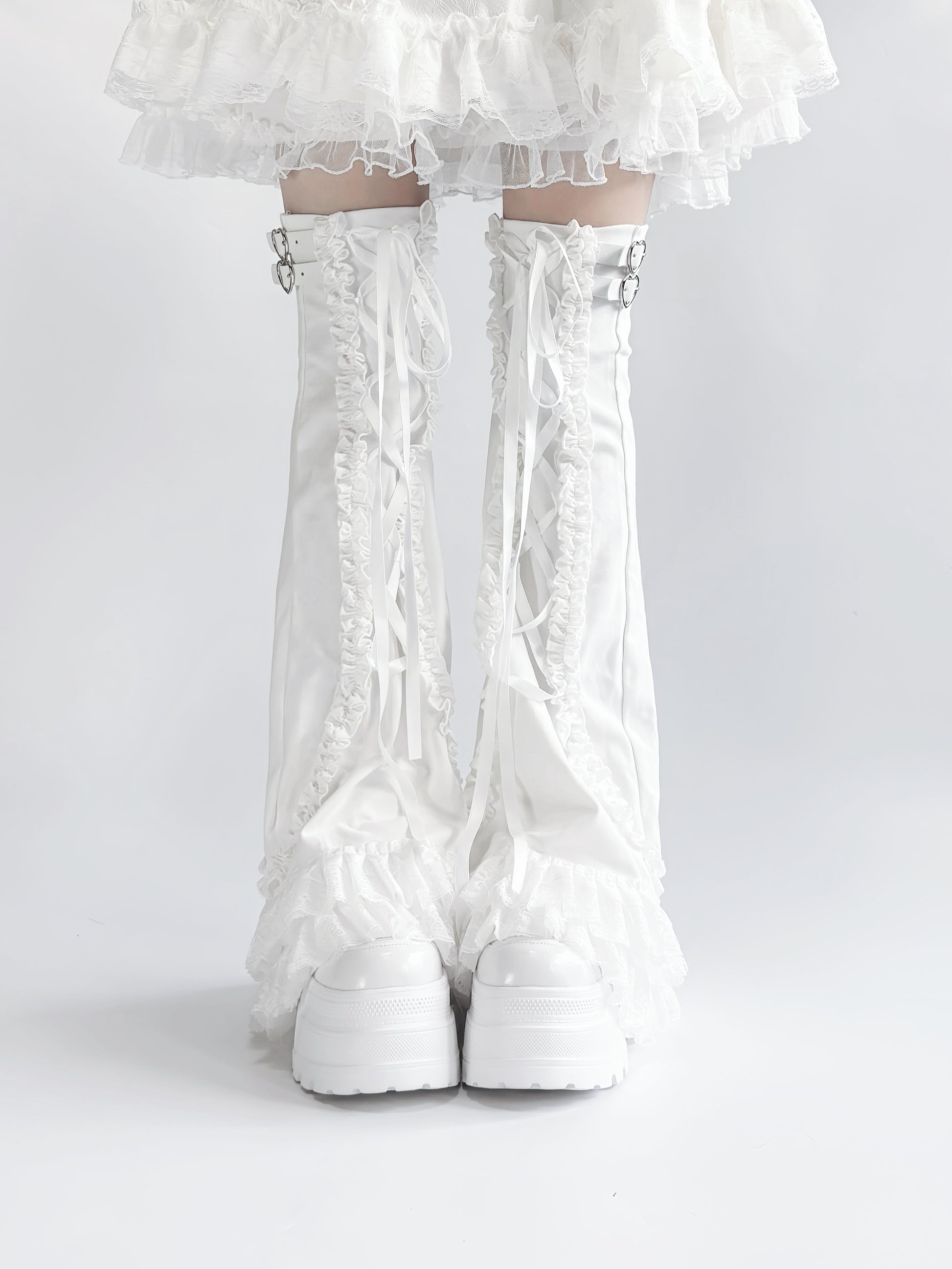 White lace-up leg warmers with a white background