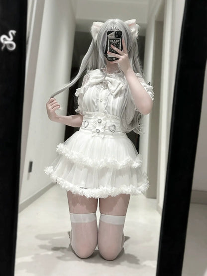 Person wearing a white dress with ruffles and a belt, standing in front of a mirror.