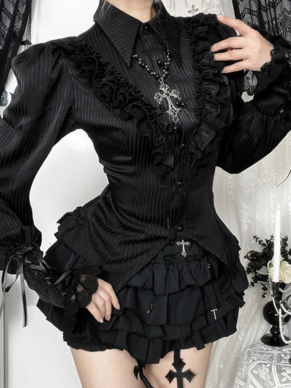 Person wearing a black gothic-style dress with intricate details.