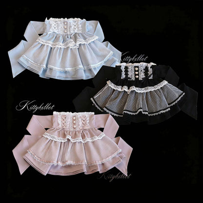 Three pet skirts in different colors with lace details on a black background