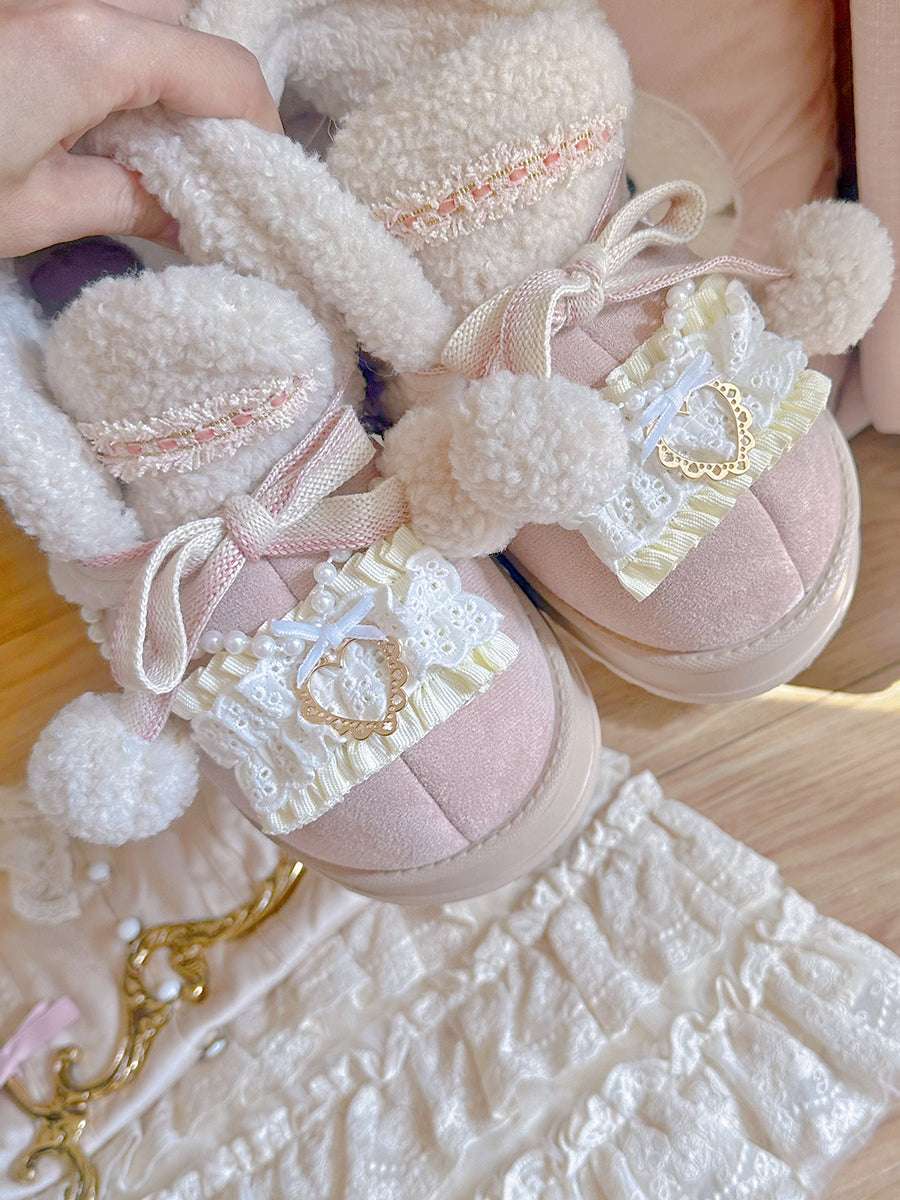 Pink shoes with decorative elements on a textured surface