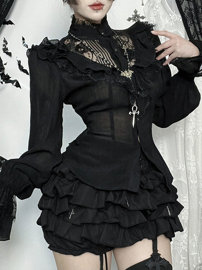 Person wearing a black gothic-style outfit with lace details on a white background