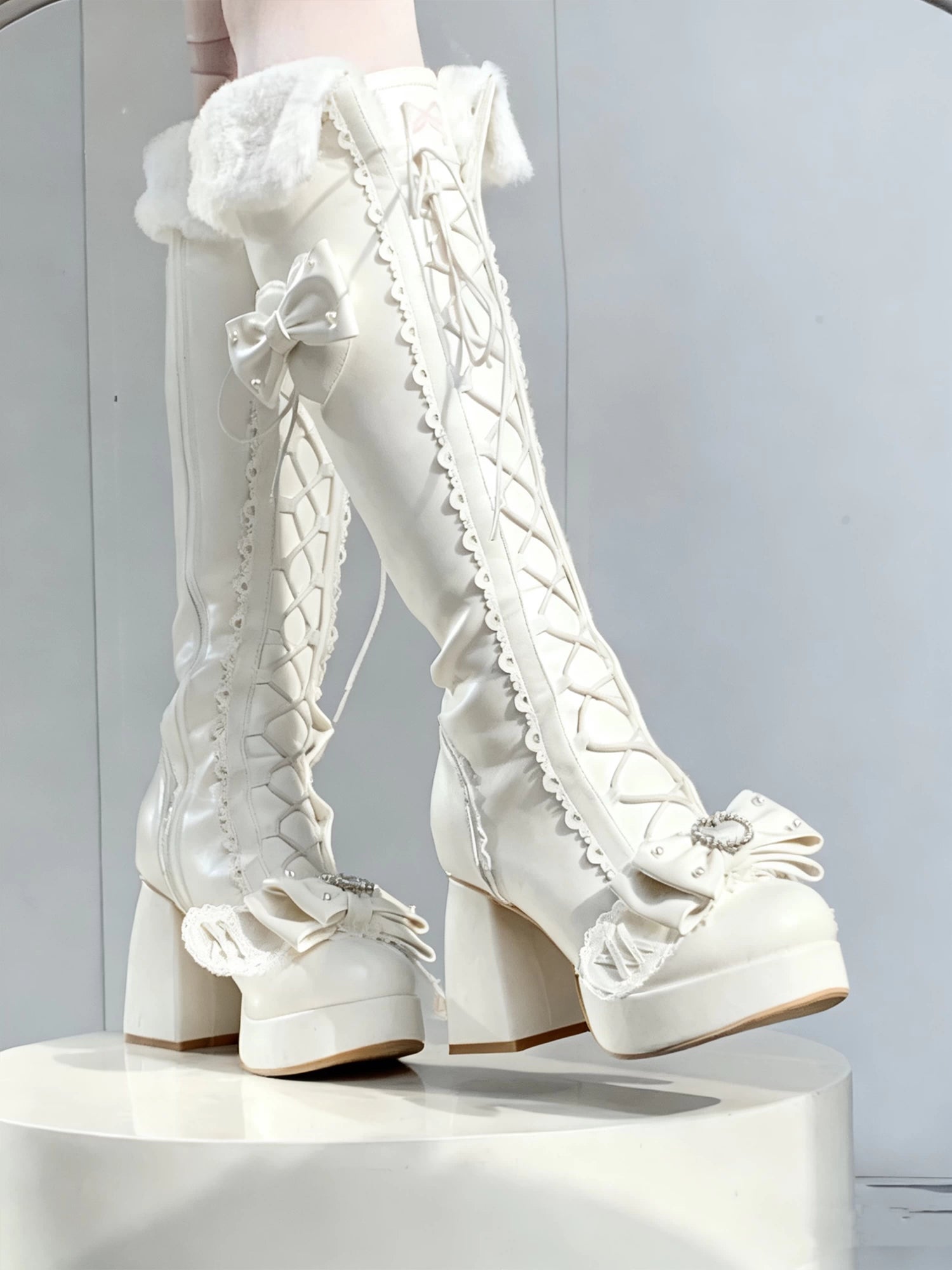 White lace-up platform boots on a white pedestal against a light gray background