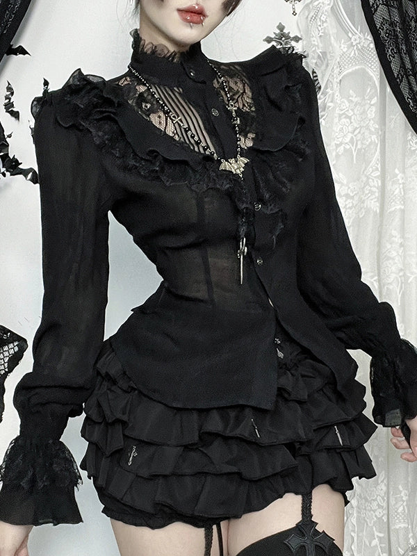Person wearing a black gothic-style dress with ruffles and lace details.