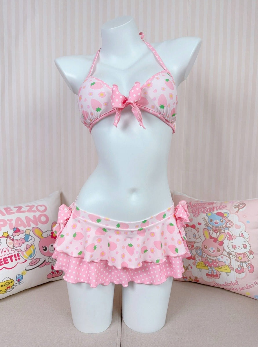 Pink floral swimsuit set on a mannequin against a light background