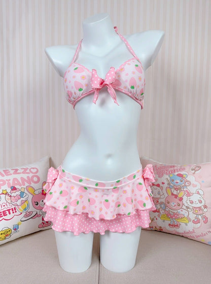 Pink floral swimsuit set on a mannequin against a light background