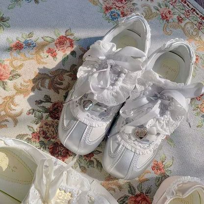 White lace-up shoes on a floral fabric background