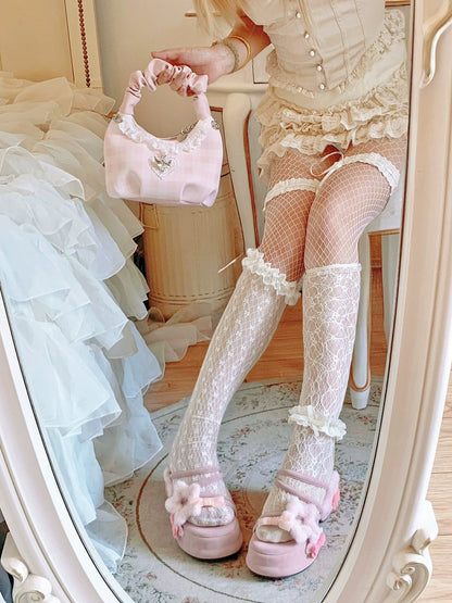 Person wearing a vintage-style outfit with lace stockings and holding a small pink handbag.