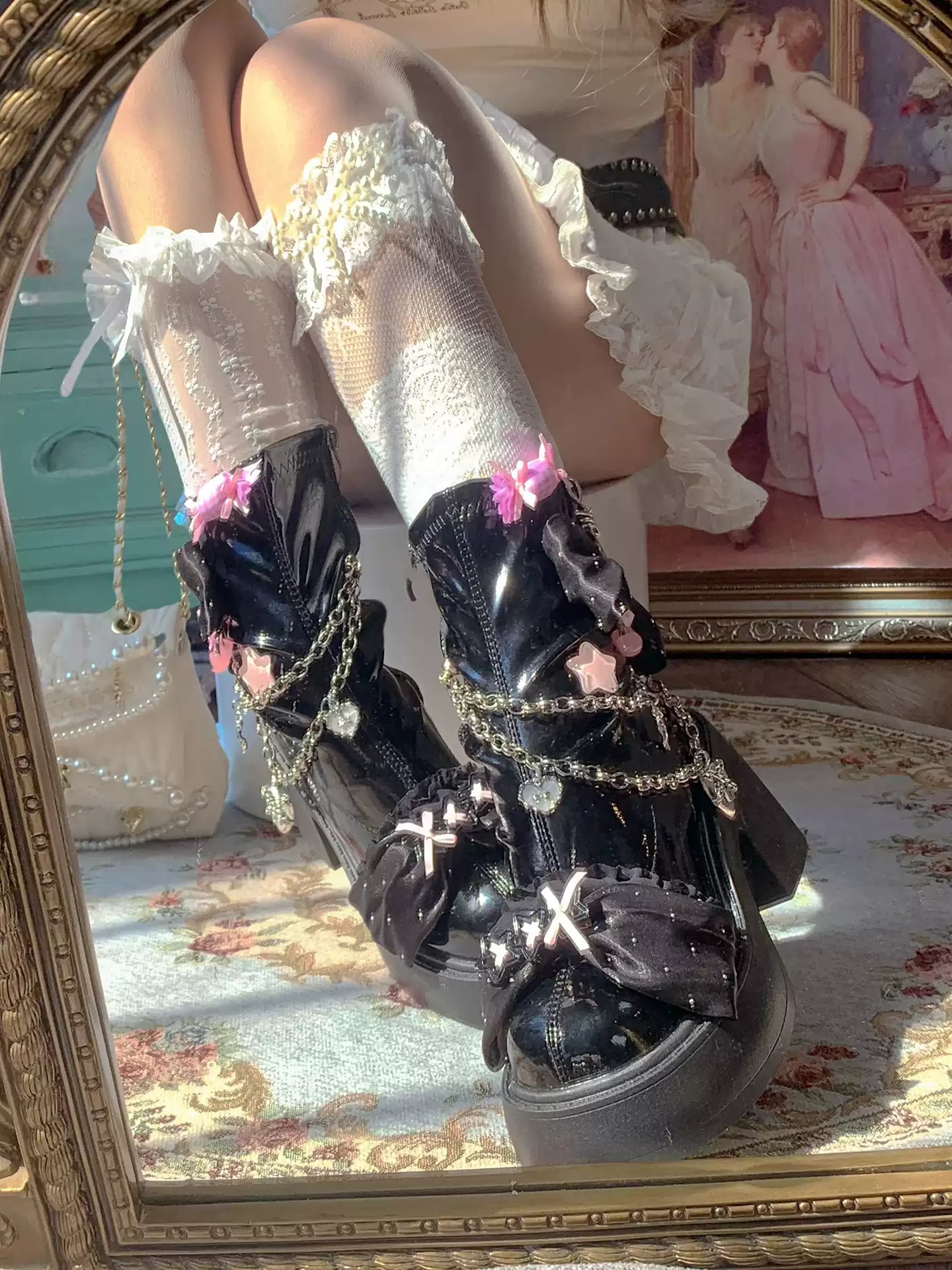 Decorative black shoes with chains and flowers worn with white stockings in a vintage setting.