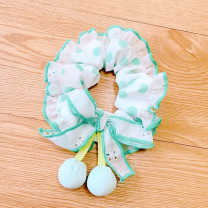White and green garter on a wooden surface